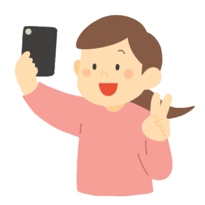 スマホで自撮りする女性の無料イラスト素材