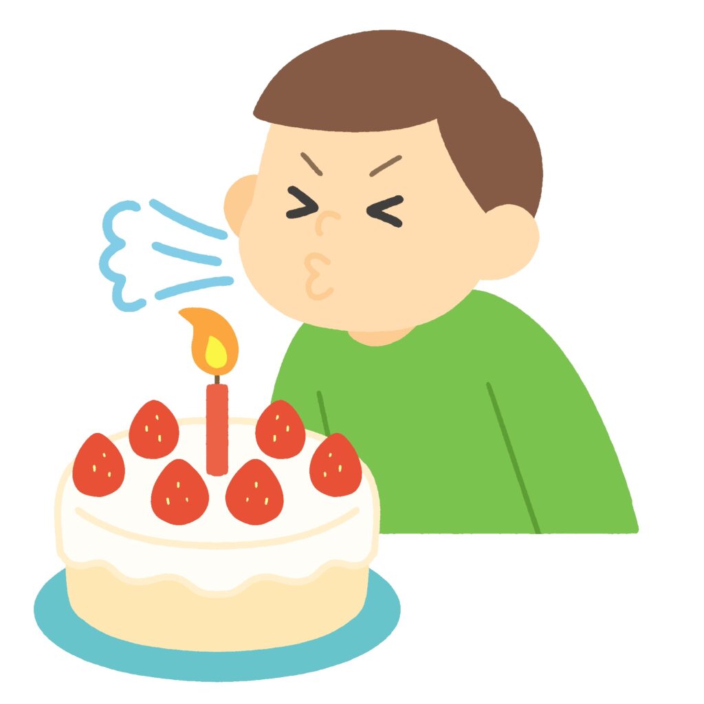 ケーキのろうそく（ロウソク・蝋燭）を吹き消す男の子の無料イラスト素材